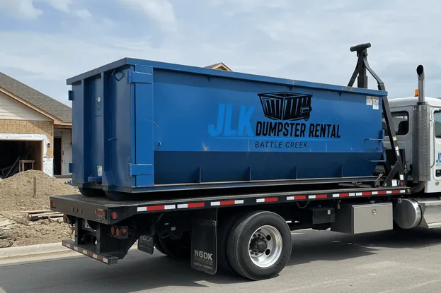 Roll-off container delivered in winter conditions in Battle Creek, MI